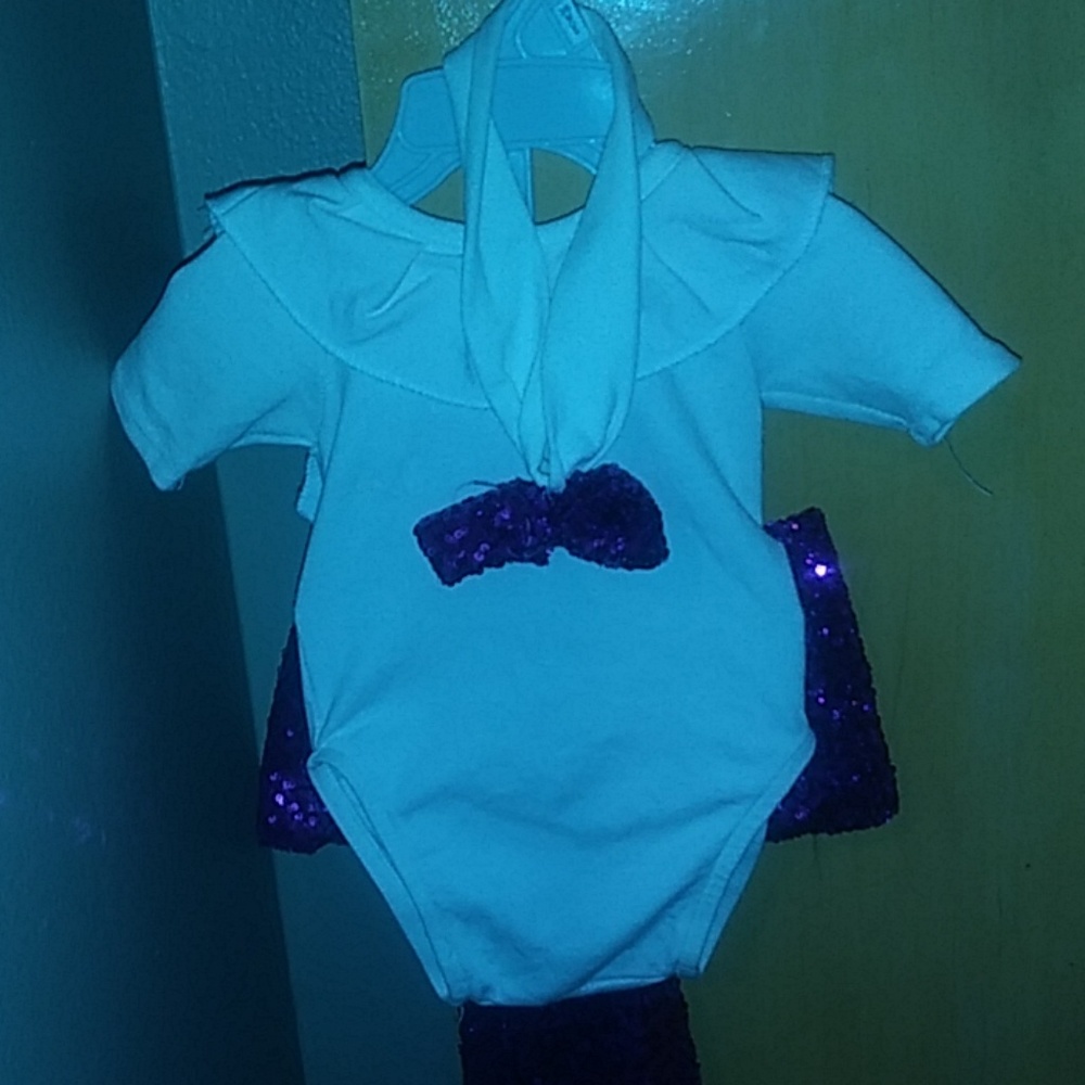 White bodysuit with big purple bow matching head b